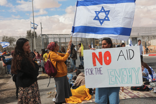 | ISRAELI DEMONSTRATORS GATHER BY THE BORDER FENCE WITH EGYPT AT THE NITZANA BORDER CROSSING IN SOUTHERN ISRAEL ON FEBRUARY 18 2024 AS THEY ATTEMPT TO BLOCK HUMANITARIAN AID TRUCKS FROM ENTERING INTO ISRAEL ON THEIR WAY TO THE GAZA STRIP PHOTO GIL COHEN MAGENAFP VIA GETTY IMAGES | MR Online
